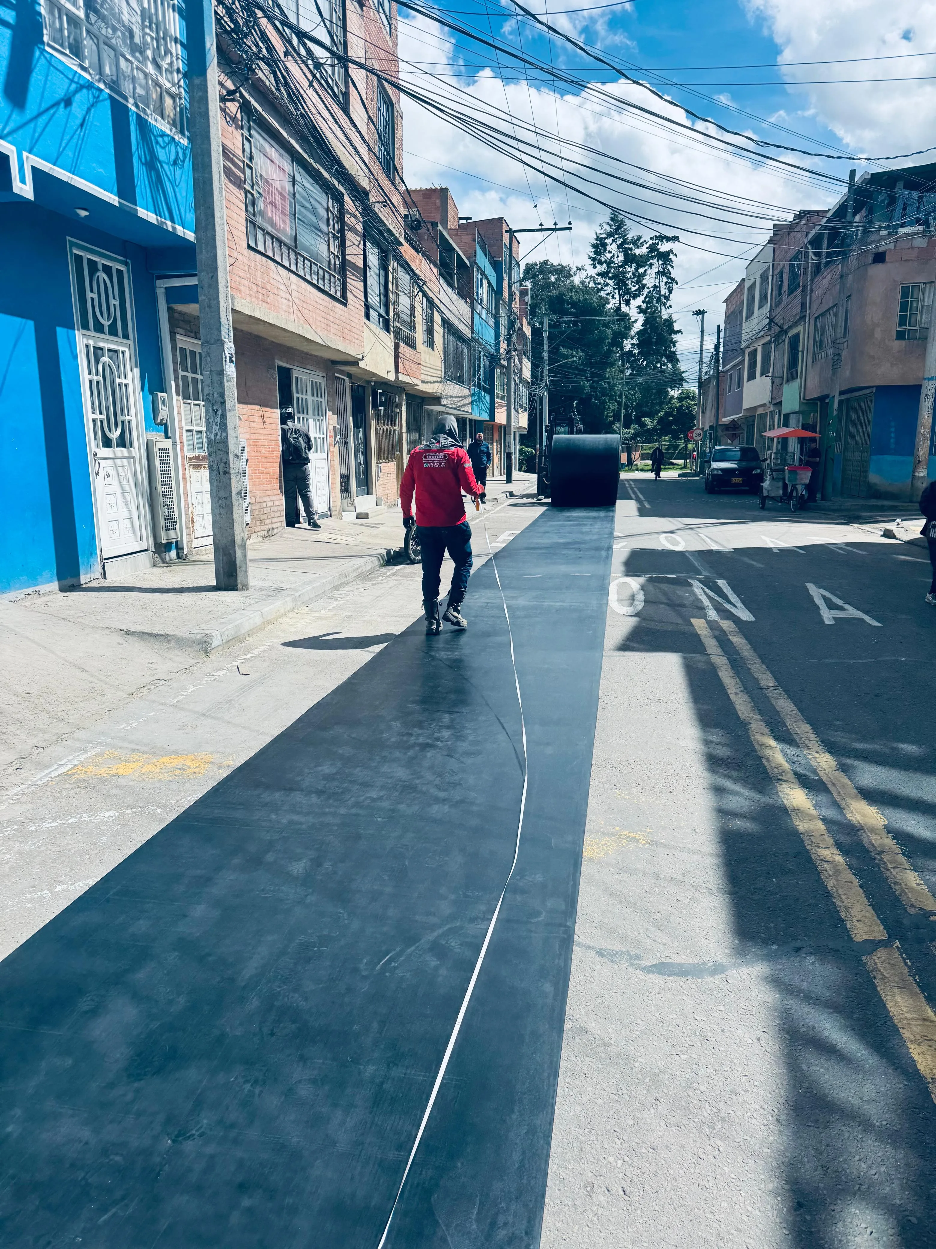 Tendido de banda transportadora en vía urbana